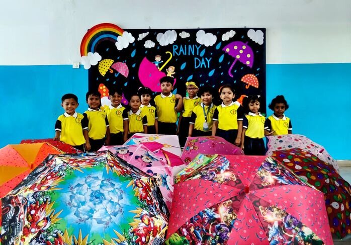 Little learner's celebrated Rainy Day with colourful Raincoats